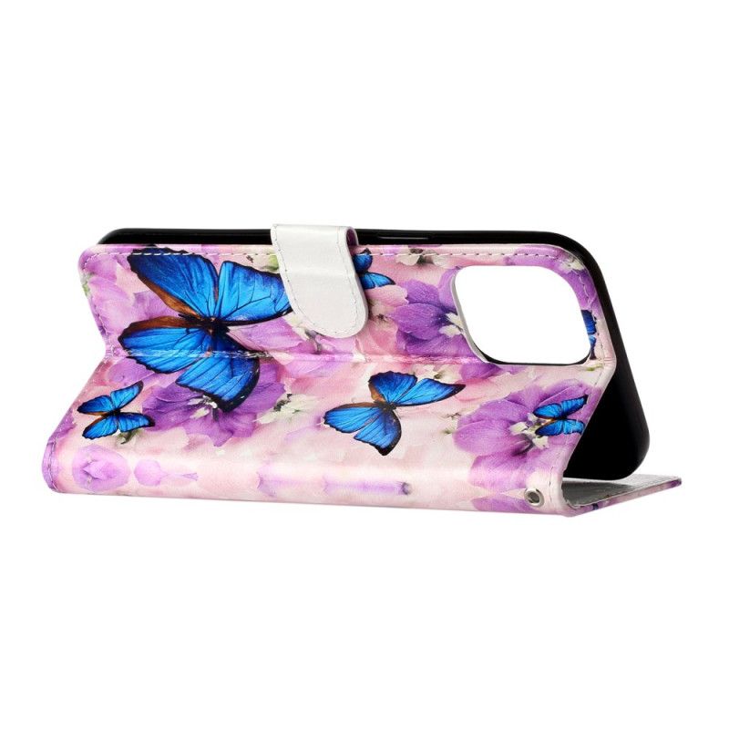 Flip Cover iPhone 16 Pro Max Sommerfugle Og Lilla Blomster Med Rem