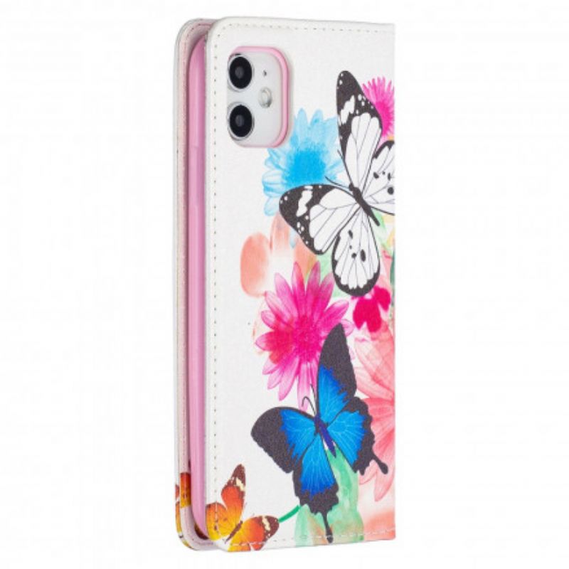 Cover iPhone 11 Flip Cover Farverige Sommerfugle