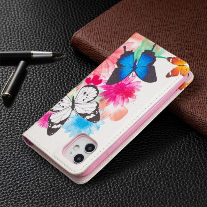 Cover iPhone 11 Flip Cover Farverige Sommerfugle